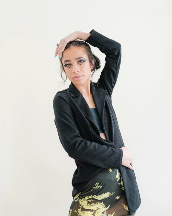 a woman posing with her hair up in her bun