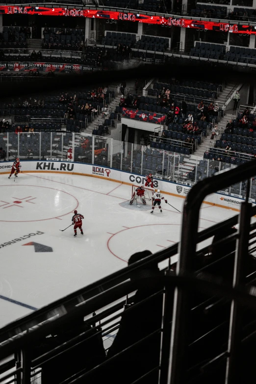 an image of people playing hockey in a stadium