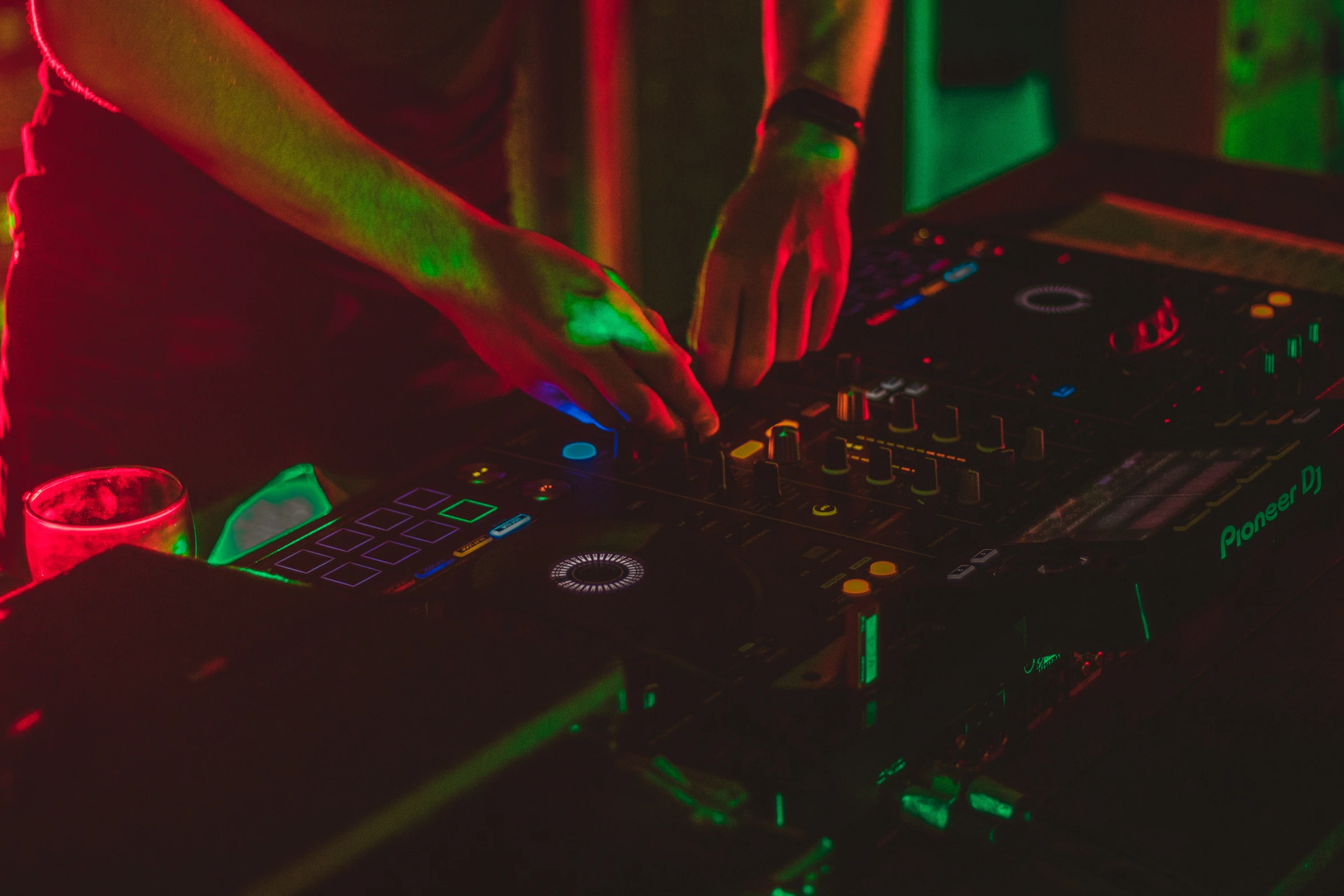 a dj mixing an electronic sound system on a stage