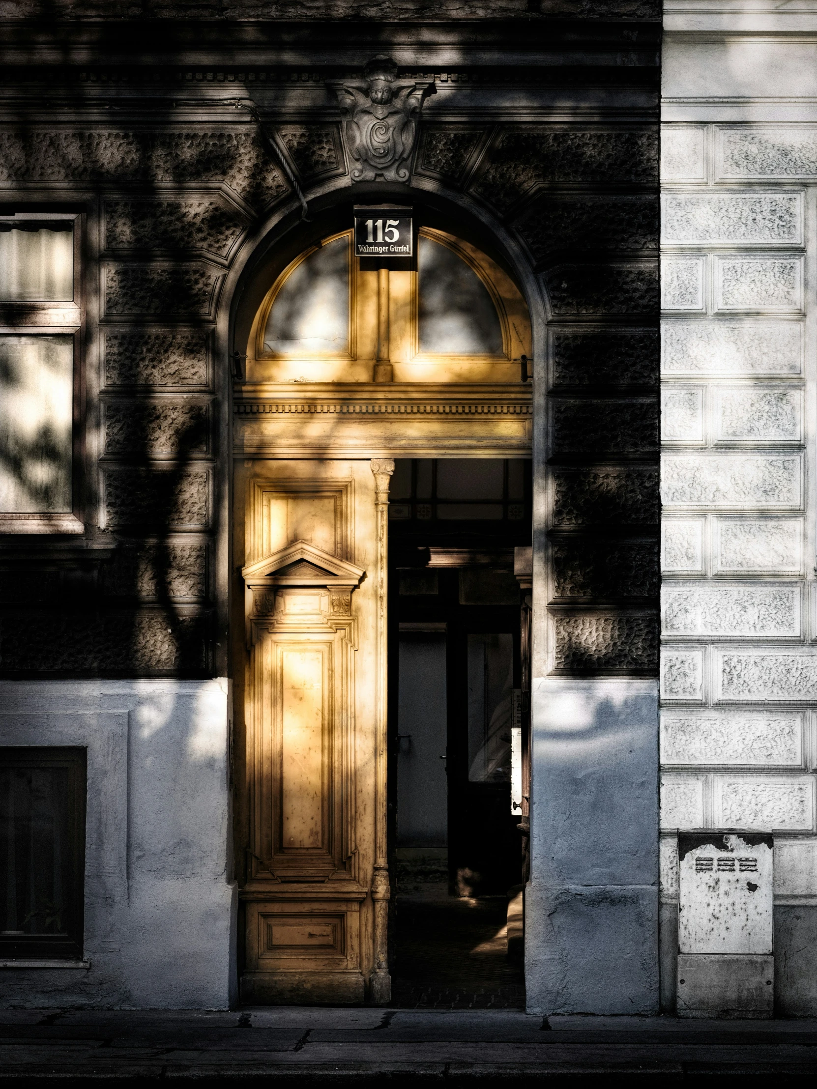 the entrance to an old building with doors and windows