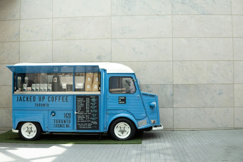 an ice cream cart with a price sign and menus on it