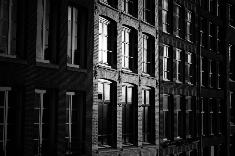 a tall brick building with lots of windows