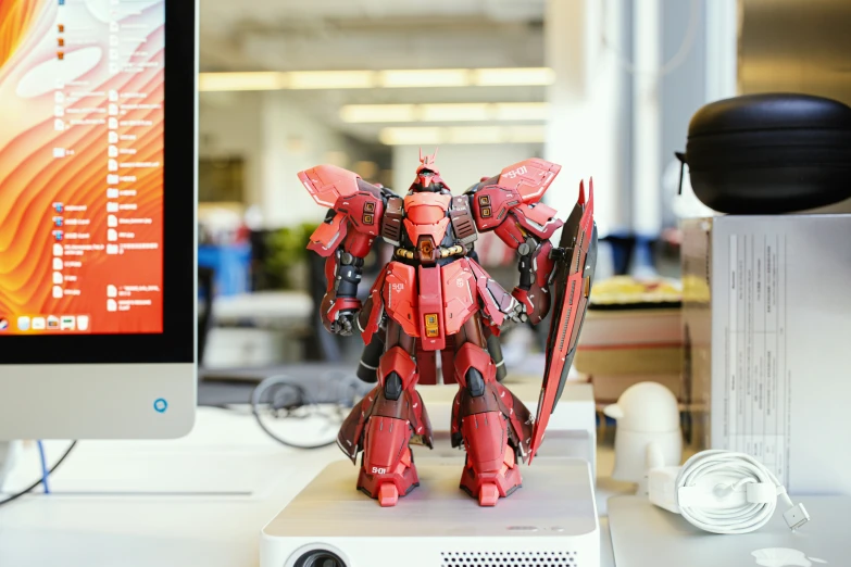 a toy robot figure on display on a desk