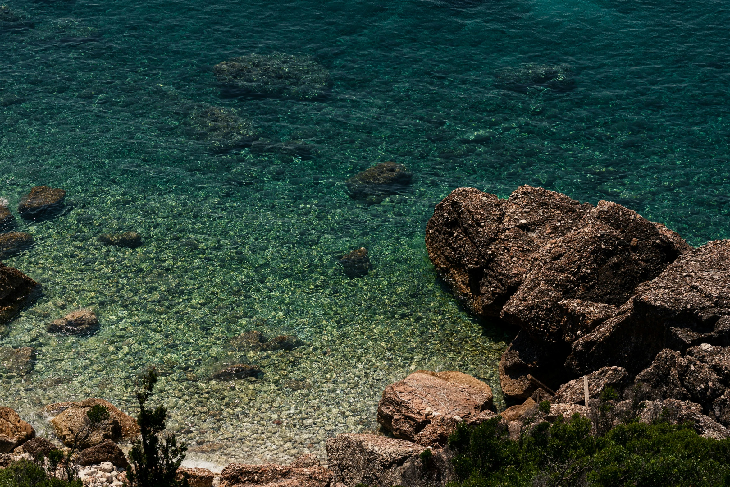 aerial s of blue waters near rocky shore