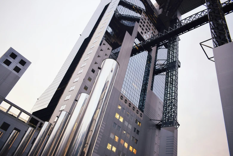 tall buildings and one cantilet - operated lights in a city