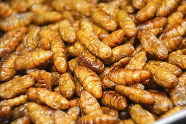 a mixture of fried bananas in a large pan