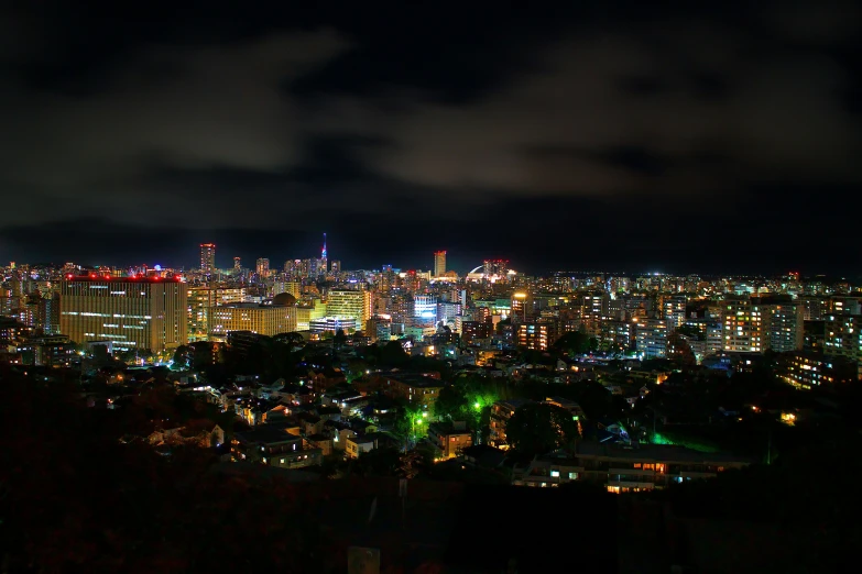 a skyline view at night with the lights on