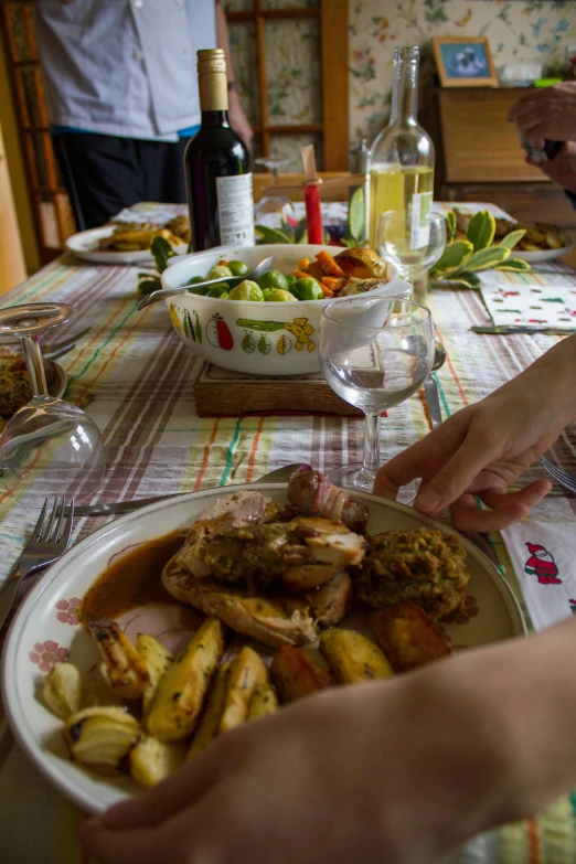 a meal of turkey, potatoes and apples is on the table