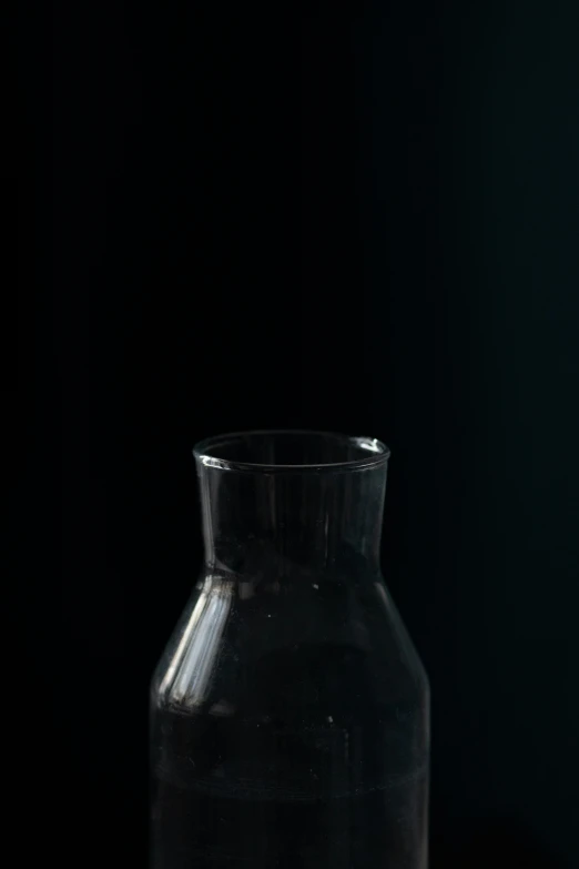 a clear, old fashioned glass container is on the counter