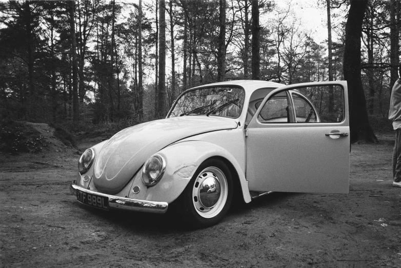 a bug is parked outside in the woods