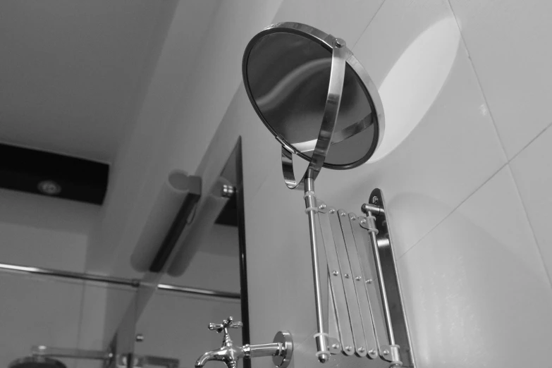 a sink with a mirror above it on the wall