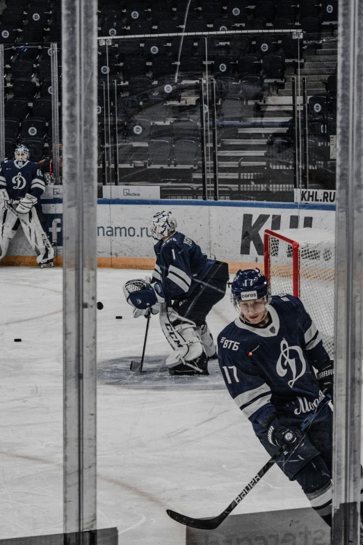 some hockey players on the ice and playing