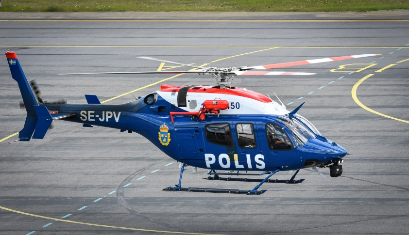 a police helicopter is on the ground in a circle
