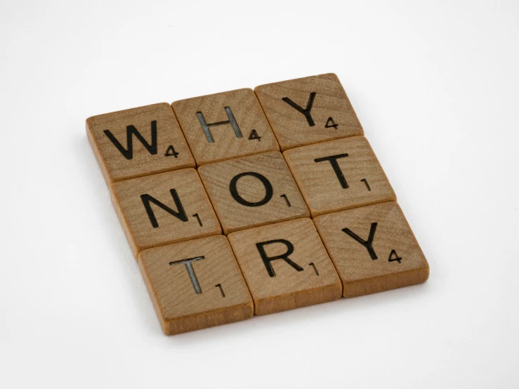 a wooden block with a word written on it