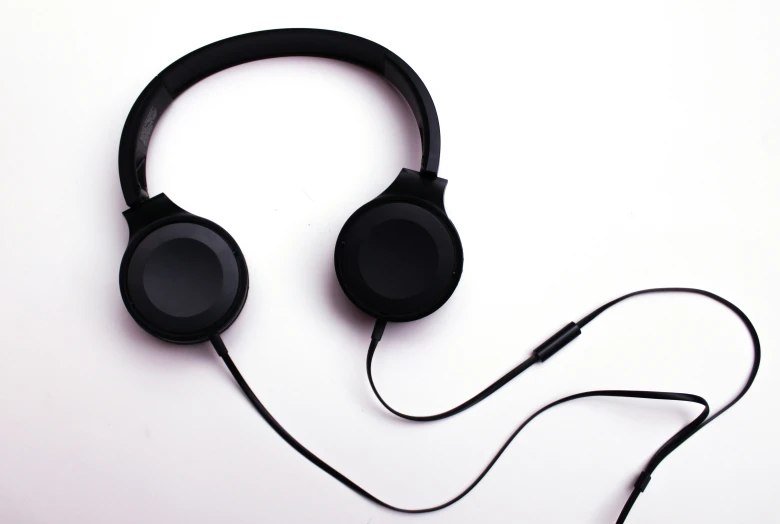 a black headphone that is on a table