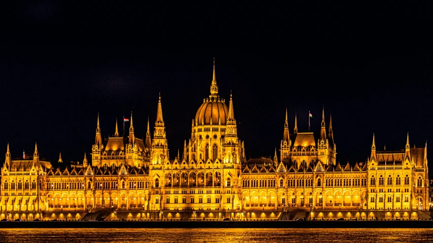 a large building that looks like it is lit up for the night