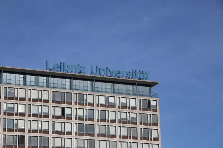 a tall building with windows and the word universal mail in front of it