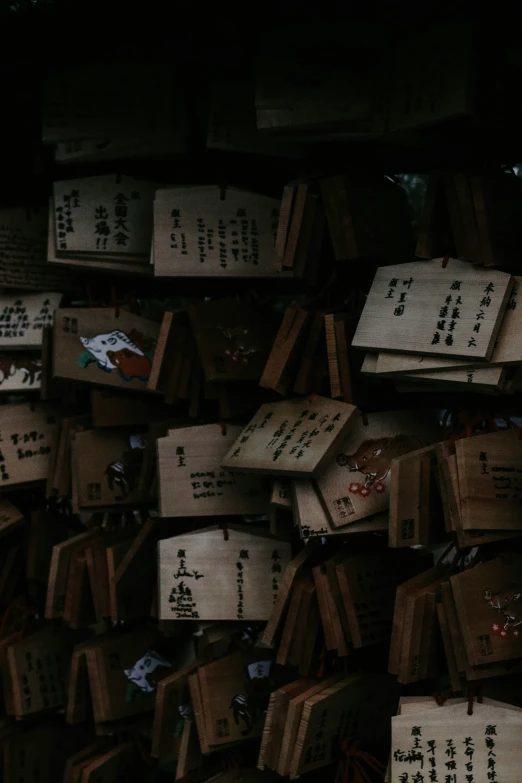 large group of wooden boxes that have writing on them