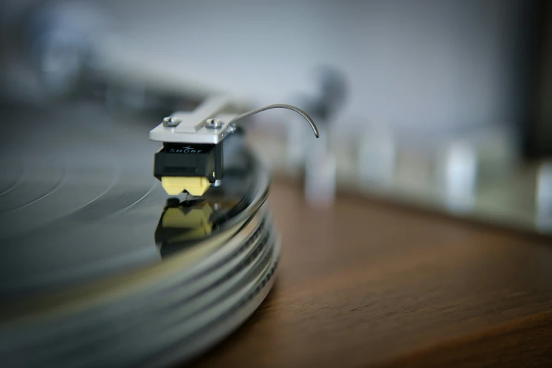 a turntable with a wooden table near other objects