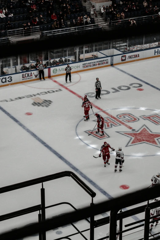 hockey players in uniform playing on the ice