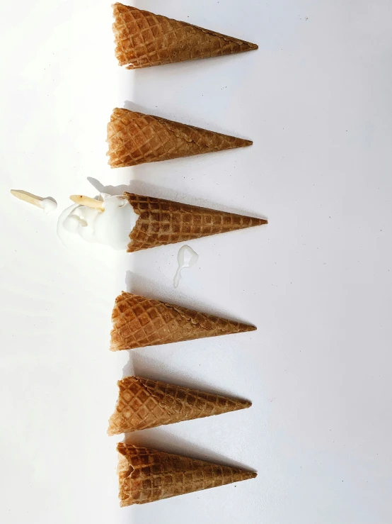 five cones of ice cream are in a row