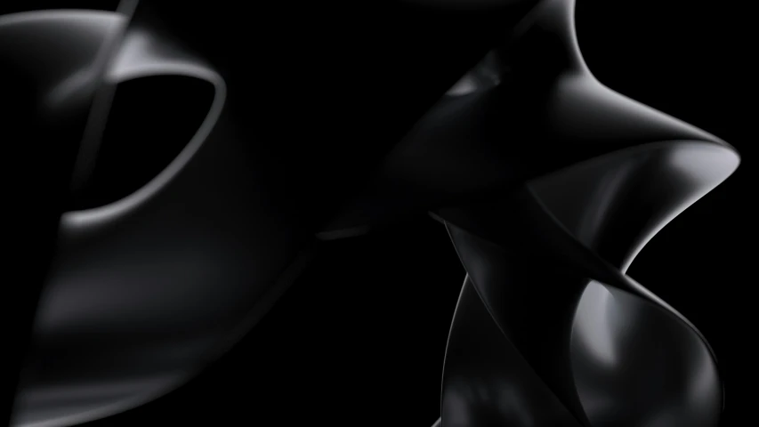 a black and white abstract sculpture is against a black background