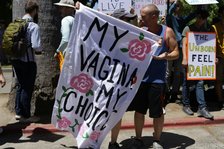 people marching in the street during the protest