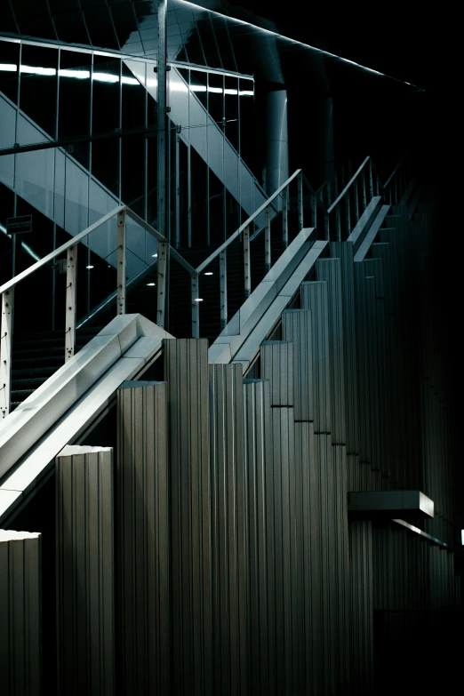 there is a wooden stairway going up to a large building