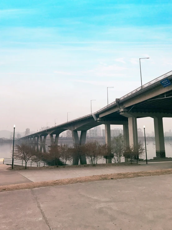 a train bridge spanning over the width of a river