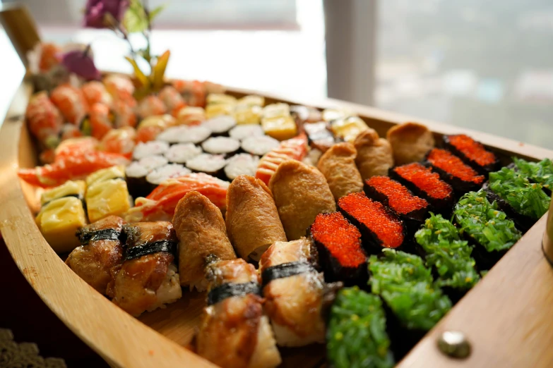 a platter filled with sushi and sashi