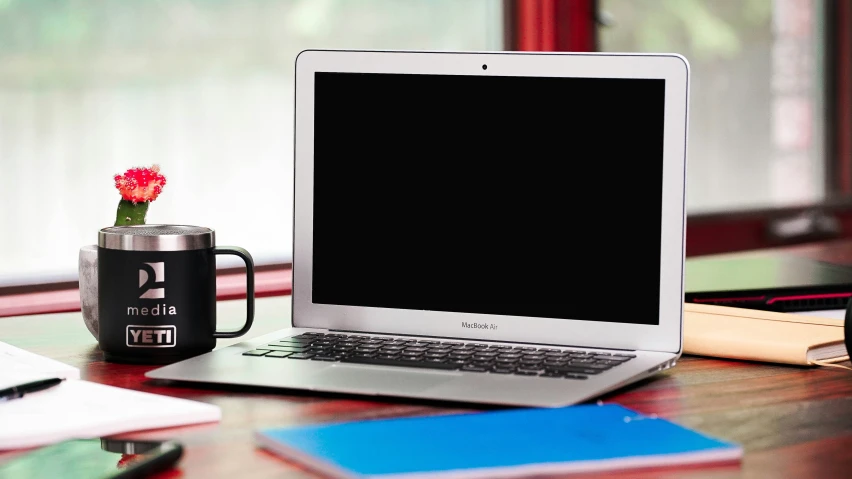 an open laptop computer sitting on top of a desk