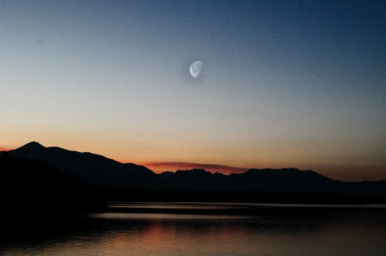 a body of water near a mountain range