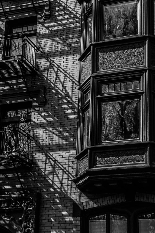 a fire escape box sitting next to a tall building