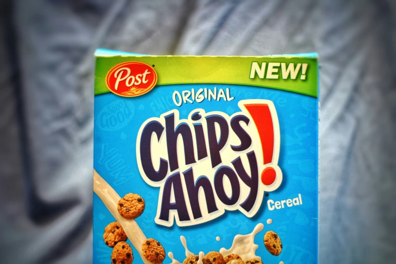 a carton of chips ahoy cereal sitting on a blue background