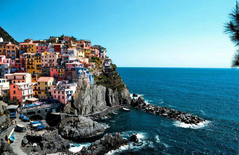 a village on a cliff overlooks the ocean