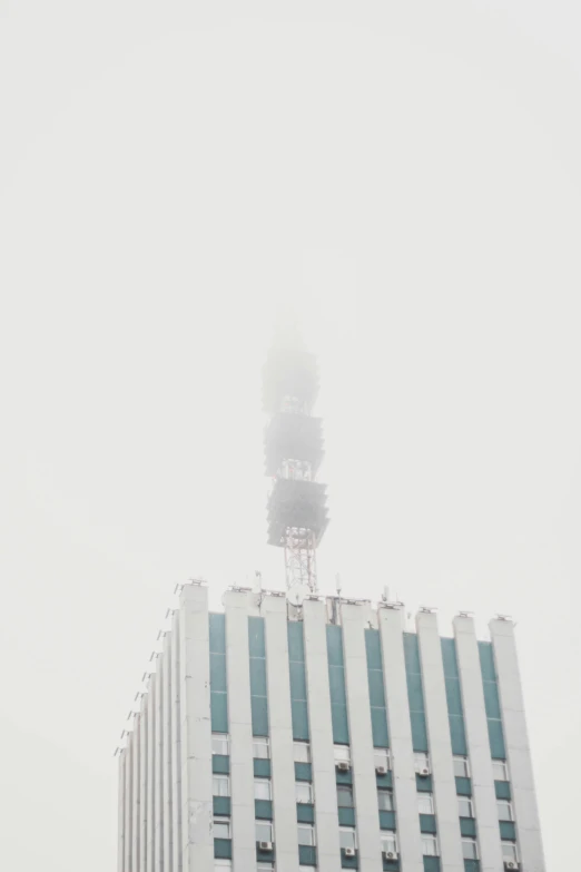 tall building with a wind tower on top