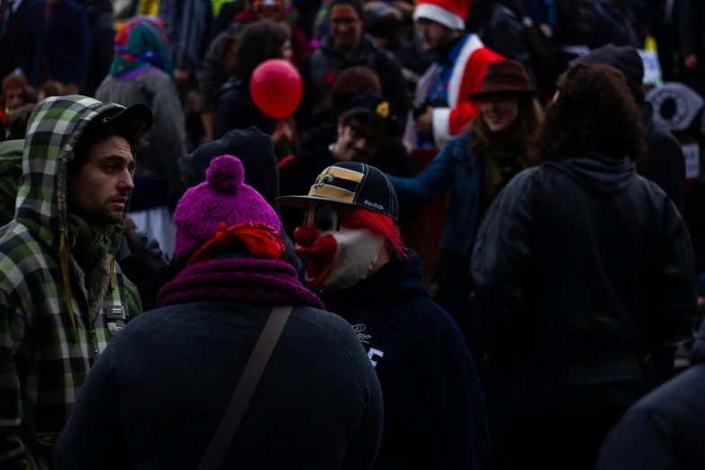 people are in the street dressed in clown costumes