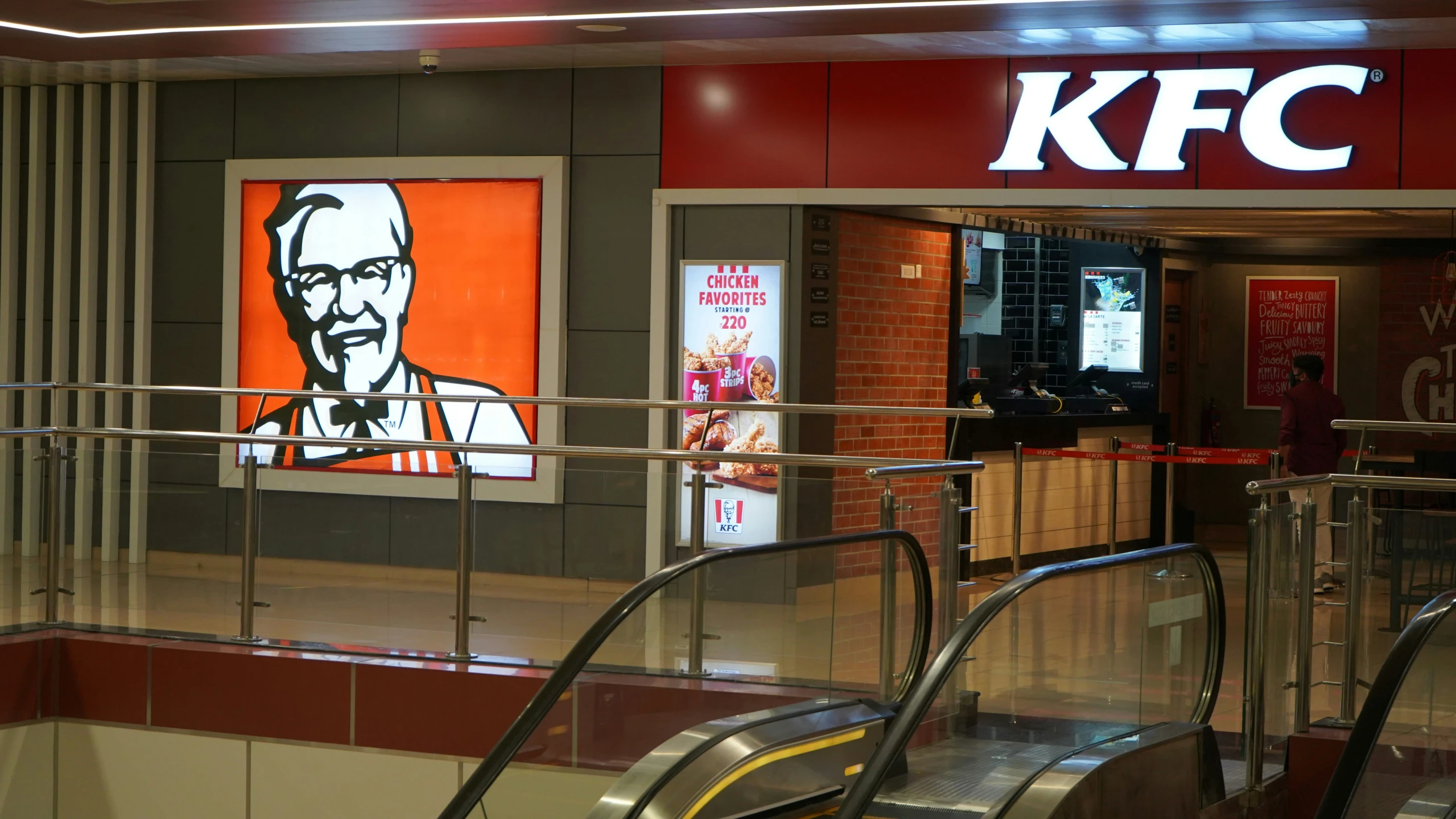 a kfc store with a large sign on the wall