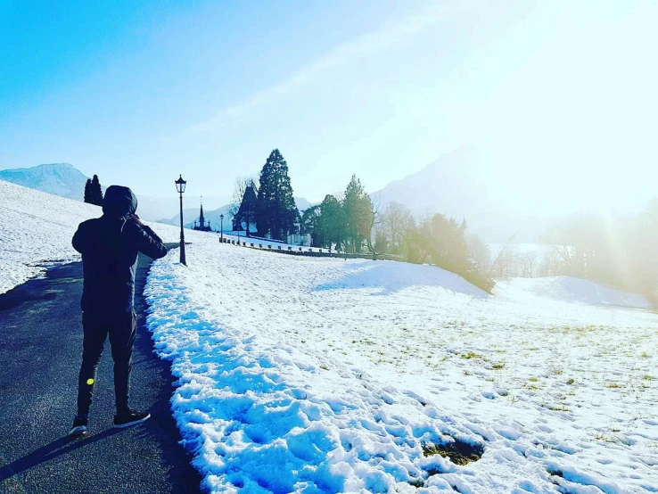 a person riding a snow board on a road