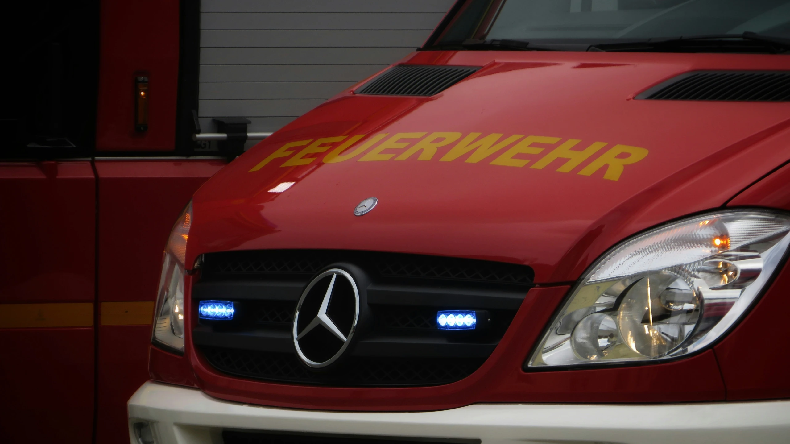 a mercedes benz truck parked with the door open