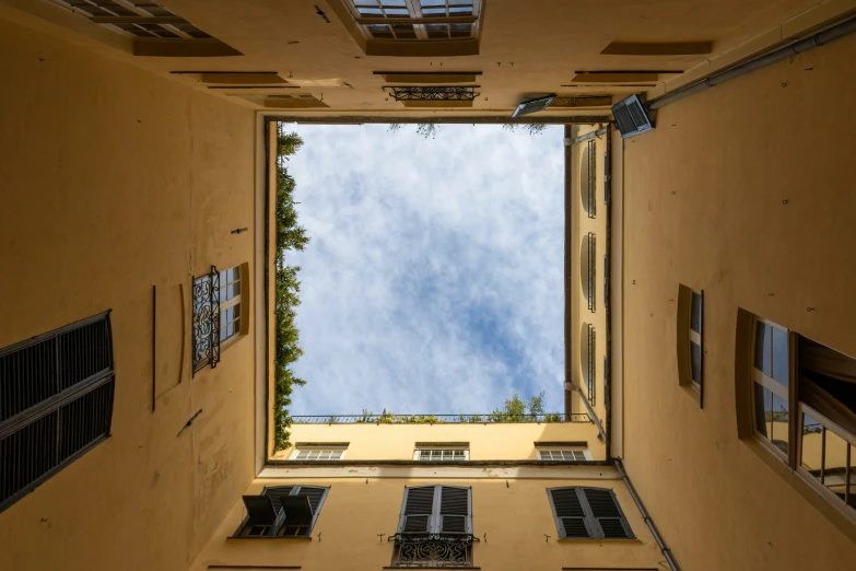 an old building's skylight windows and balconies is shown from the ground