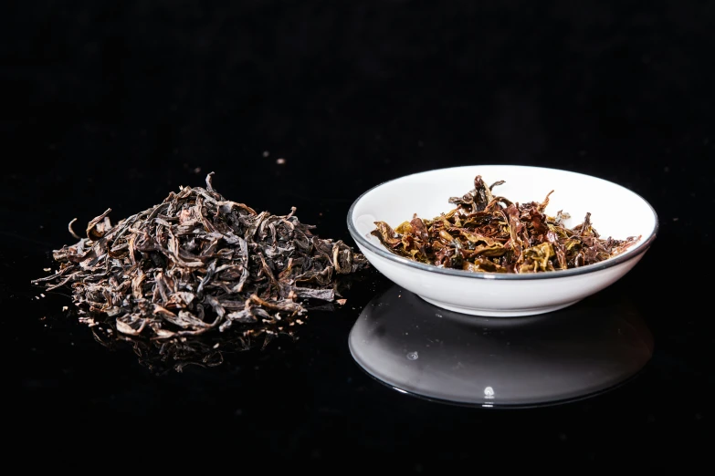 there is an image of a bowl of dried herbs