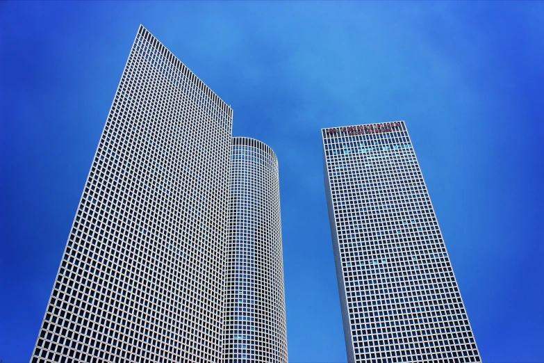 a po taken from the ground looking up at some buildings