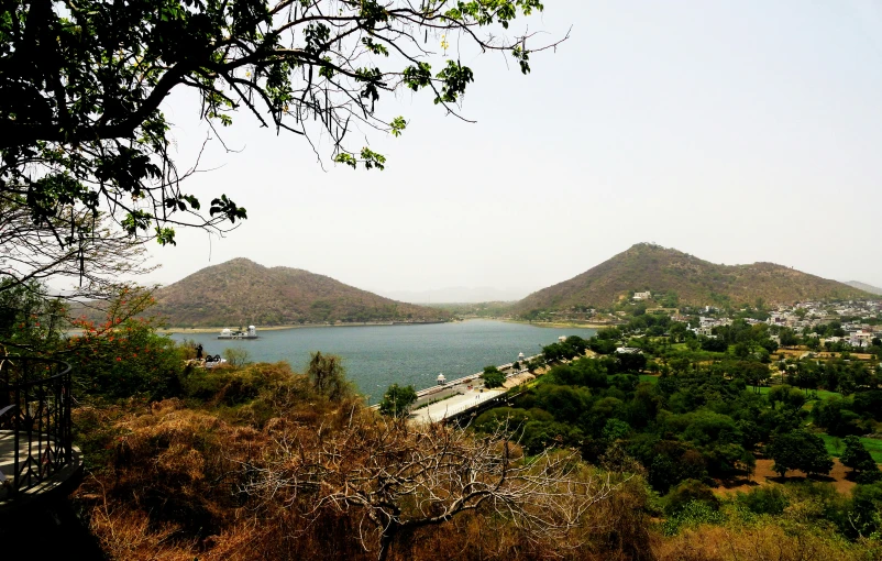 a view over a mountain and water in the distance