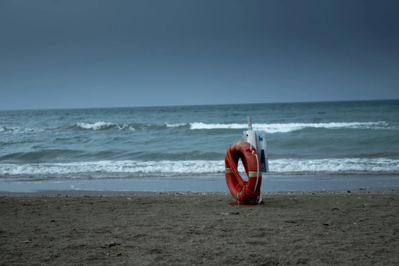 life jacket and life buoy are left on a beach