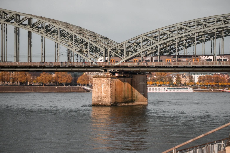 a train crossing a bridge over a river