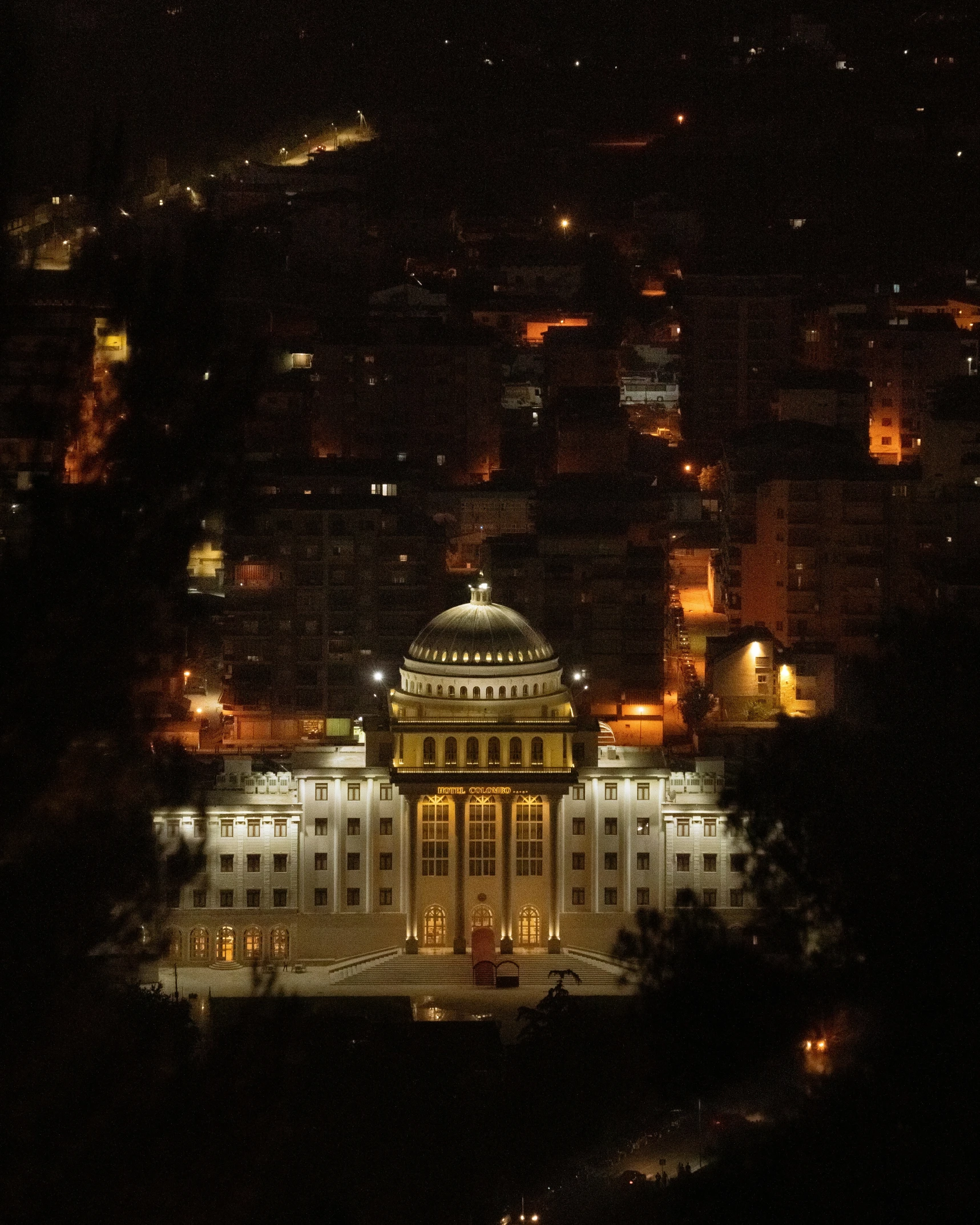 some buildings lights in the night and lights are on