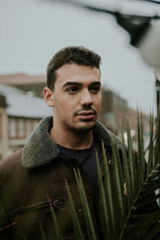 a close up of a person near some plants