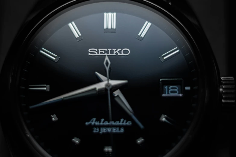 a seiko watch with the name and date displayed