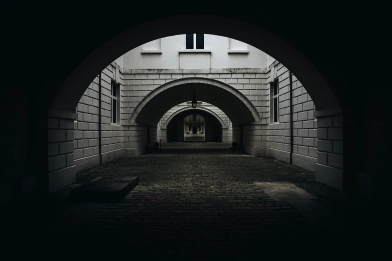 a long tunnel with an archway in it